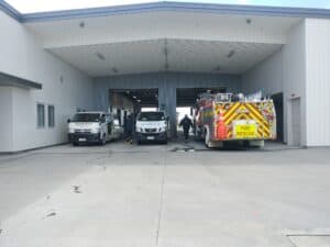 Triple Star Commercial Cleaning flood restoration vehicles parked at an emergency site in Christchurch.