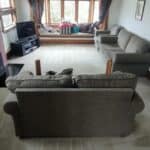 Professionally cleaned couches and carpet in a tidy living room.