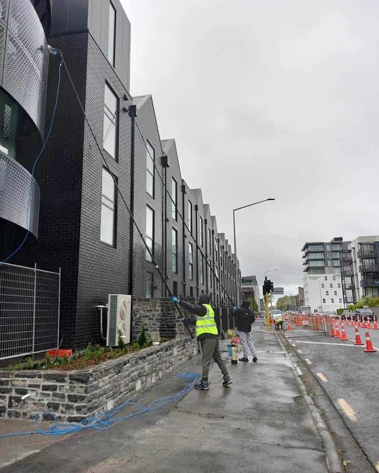 Triple Star Commercial Cleaning team performing a high-rise exterior building wash and window cleaning in Christchurch and Auckland