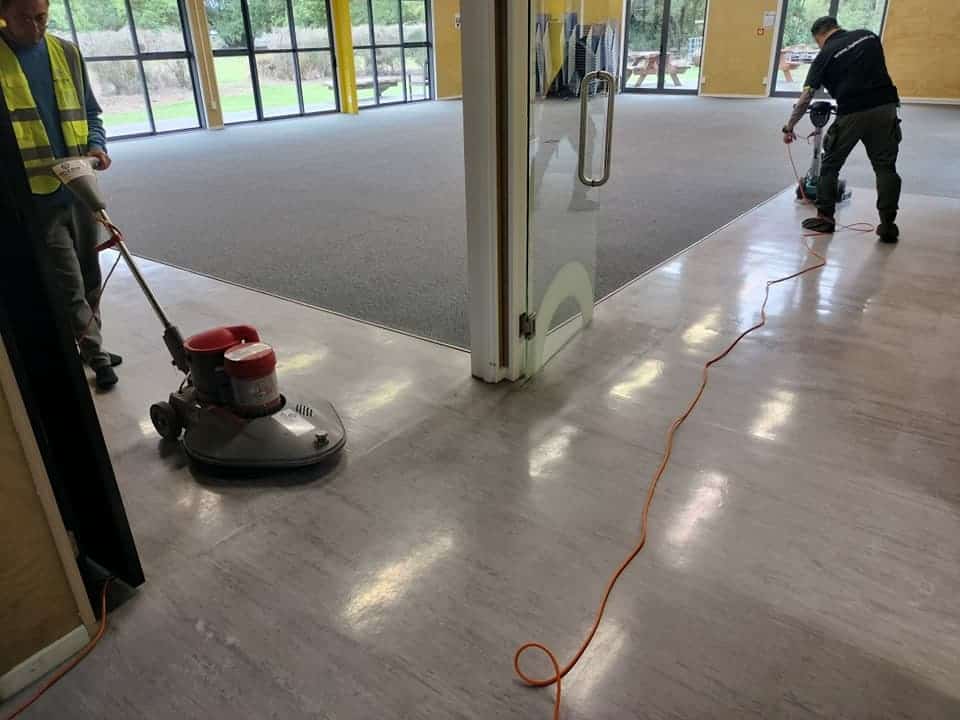 Triple Star Commercial Cleaning staff performing end-of-lease commercial floor cleaning in a large venue in Auckland and Christchurch